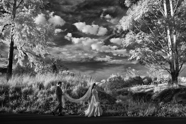 photo by destination wedding photographer Vinicius Matos - gorgeous black and white photo of bride and groom in open landscape